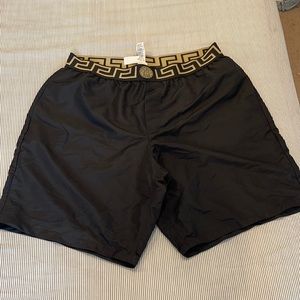 Men size 7 Versace swimming trunks.